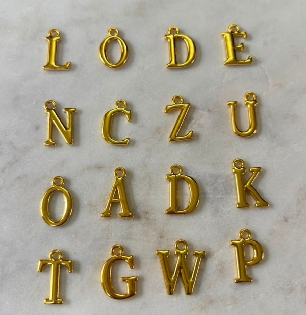 Golden alphabet charm
